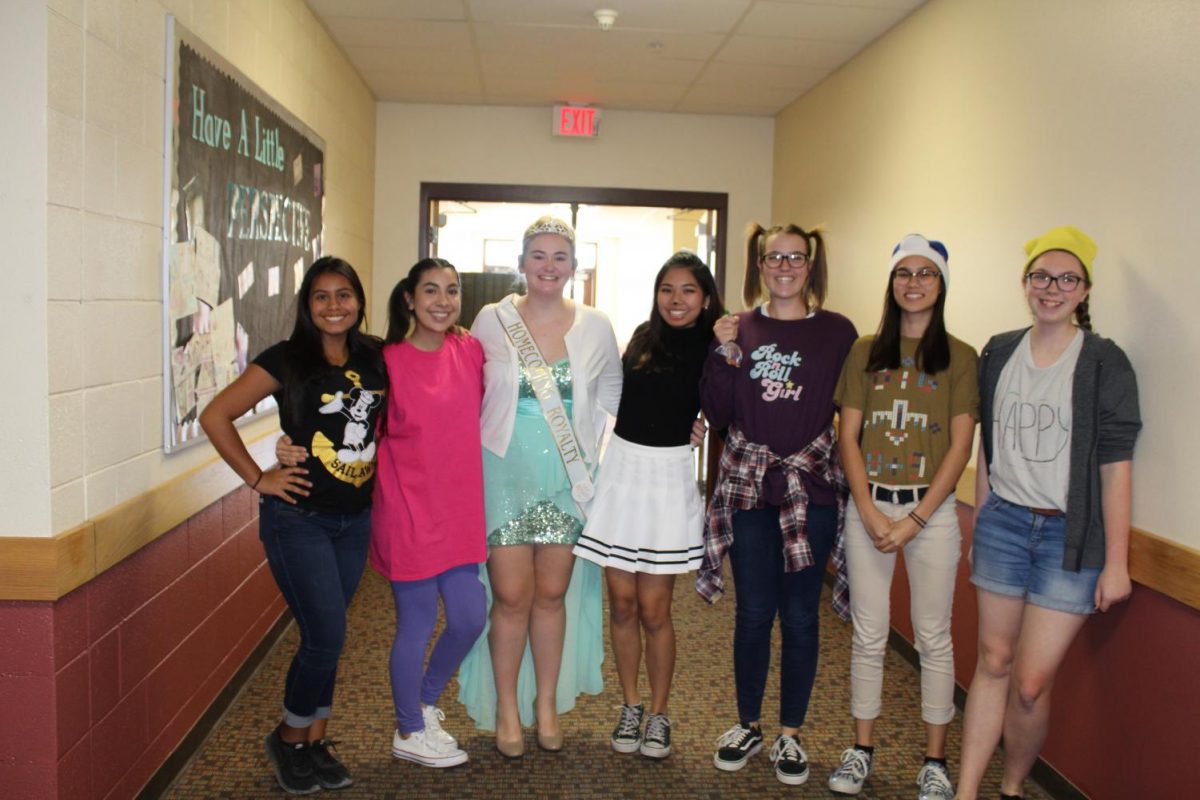 Left to right: Junior Samantha Holguin and seniors Layna Rubio, Autumn Froitland, Katrina Ortiz, Hallie Parke, Samantha Hachmann and Cayla Vaughan all took part in the Toon Town Tuesday dress down day for homecoming spirit week.