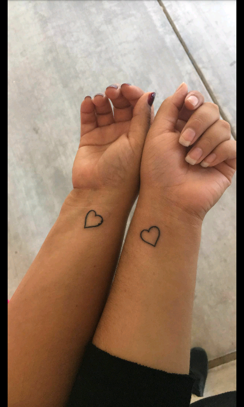 Junior Karissa Jimenez and her mother share matching heart tattoos on their wrists.