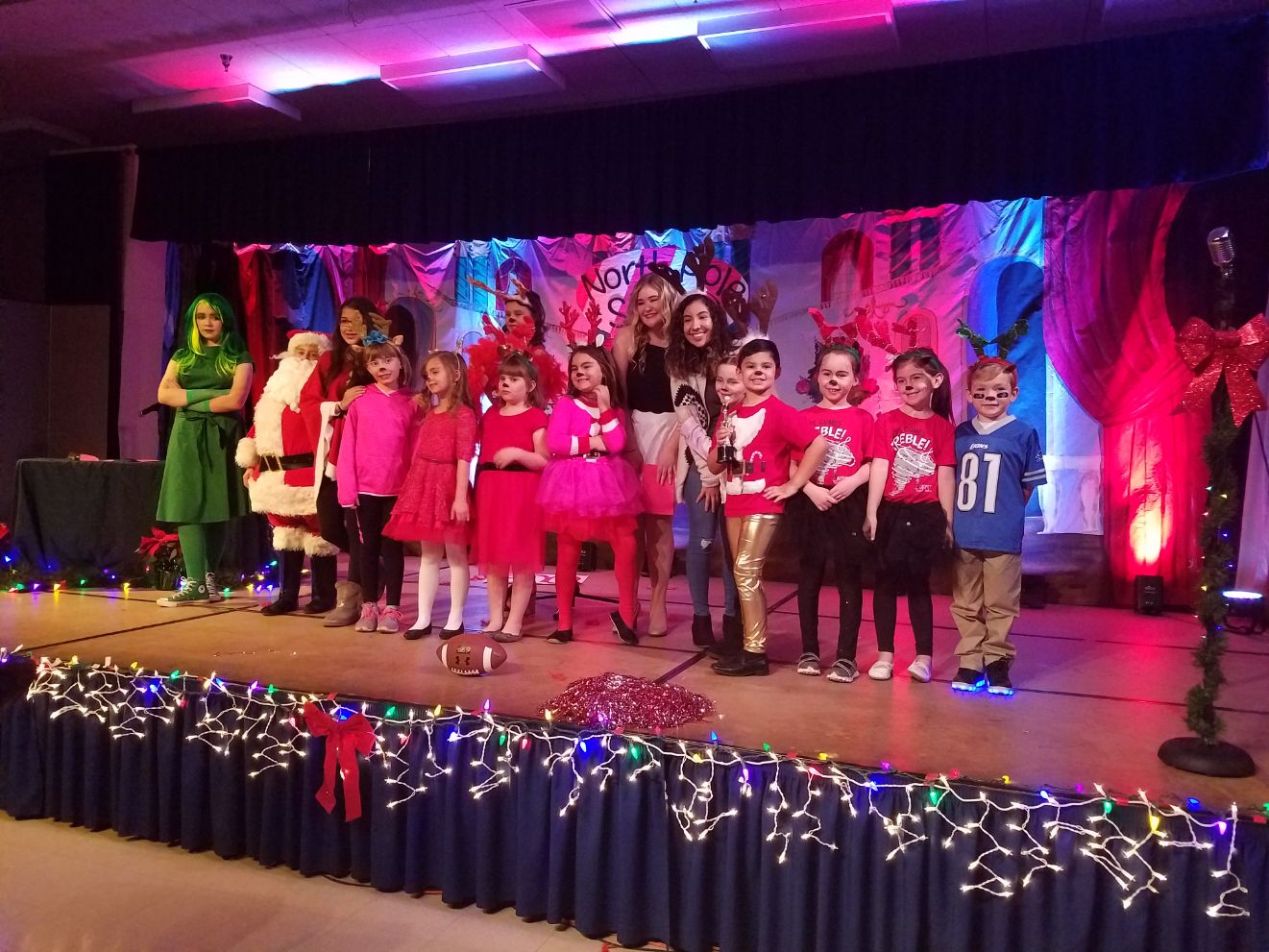 The cast of Rosefield's North Pole Star are met with a round of applause as they gather for their group photo.